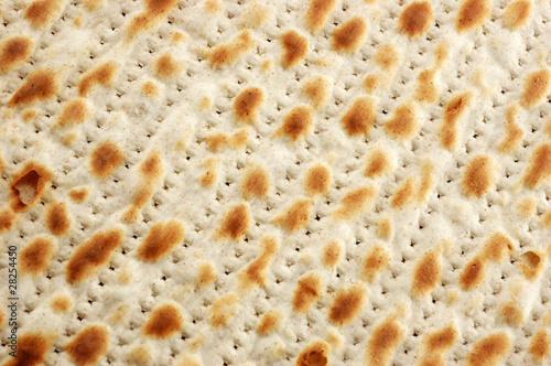 Photo: Jewish ritual holiday food unleavened bread -matzoh (background Jewish ritual holiday food unleavened bread -matzoh (background
