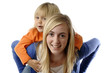 Teenage girl piggybacks a toddler
