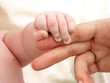 Baby holding daddies finger. Baby holding daddies finger.