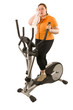 Übergewichte Frau schwitzt auf dem Hometrainer