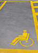 Yellow road marking for disabled parking space Yellow road marking for disabled parking space