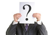 Foto: Businessman is searching for answers Businessman is searching for answers