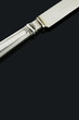 Old silverware knife on black