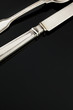 Old silverware knife on black