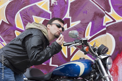 Photo: Motorcycle Man Making Up with Lipstick Motorcycle Man Making Up with Lipstick