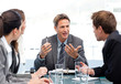 Foto: Charismatic chairman talking with his team Charismatic chairman talking with his team