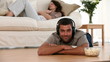 Man at Home listening to music on the ground