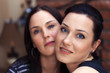 Two elegant sexy sisters looking at camera