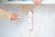 hand in roller painting wall hand in roller painting wall