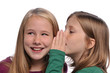 Little girls sharing a secret