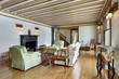 Living room with wood trimmed ceiling