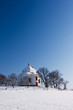 Village chapel in winter countryside