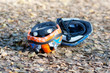 Two cycling helmets upside-down on the ground