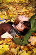 Girl with boy on the leaves