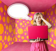 blonde in pink dress with laptop and bubble