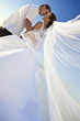 Bride & Groom Married Couple Kissing at Beach Wedding