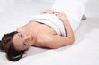 A young woman wrapped in a bath towel
