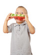 Foto: Little boy eating watermelon with drops of juice on shirt Little boy eating watermelon with drops of juice on shirt