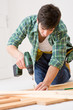 Home improvement - handyman installing wooden floor Home improvement - handyman installing wooden floor