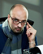 Old fashioned bald writer in glasses writing book Old fashioned bald writer in glasses writing book