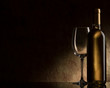 bottle with white wine and glass