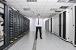 young engeneer in datacenter server room