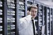 it engeneer talking by phone at network room
