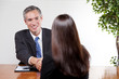 Photo: Man interviewing Woman Man interviewing Woman