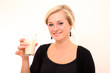 Closeup of a beautiful young girl drinking milk