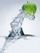 Green apple in water