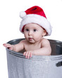 Baby Wearing Santa Hat in Wash Basin Baby Wearing Santa Hat in Wash Basin