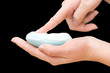 Soap in hand isolated on black background
