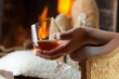 Resting at the burning fireplace fire with a glass of cognac