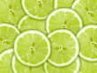 Abstract green background with citrus-fruit of lime slices Abstract green background with citrus-fruit of lime slices