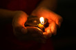 Oil lamp in hands