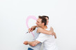 Lovely couple hugging while renovating their bedroom