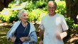 Elderly couple taking a break after running