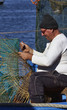Photo: Italy, Sicily, a fisherman making a lobster pot Italy, Sicily, a fisherman making a lobster pot