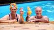 Happy old couple relaxing in the swimming pool