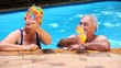 Happy mature couple relaxing in the swimming pool
