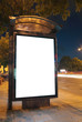Bus stop at night.