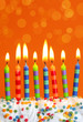 Birthday candles on brown background