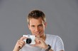 Young man with a camera