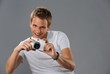 Young man with a camera