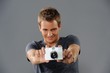 Young man with a camera
