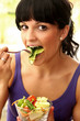 Young Woman Eating Salad. Model Released