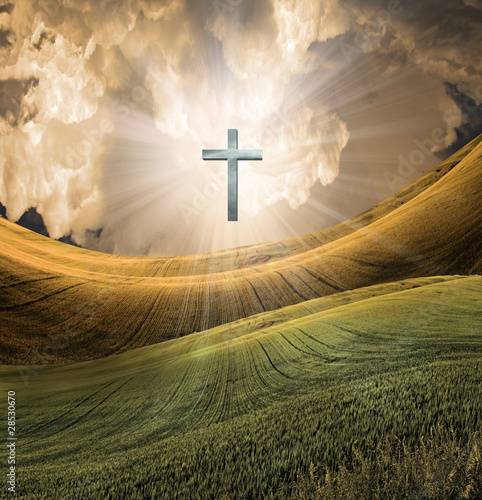 Photo: Cross radiates light in sky Cross radiates light in sky