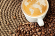 Photo: Cup of cappuccino with world map formed by milk foam Cup of cappuccino with world map formed by milk foam