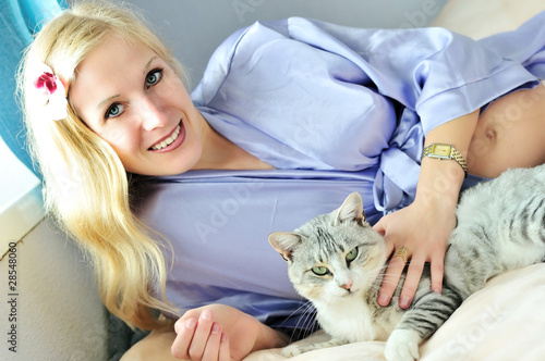 Photo: happy pregnant woman with cat happy pregnant woman with cat