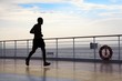 silhouette of man is running on deck of cruised ship